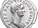 a silver coin with an image of a woman wearing a headdress