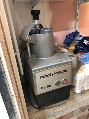 a machine that is sitting on the counter in the kitchen