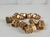 a bunch of brass fittings on a white surface