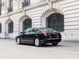 a black car that is parked in front of a building