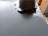 a helmet sitting on top of a table in a room