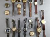 a lot of watches that are sitting on a table