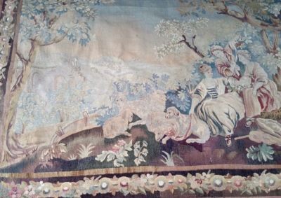 a painting on the wall of a room with a painting on the wall