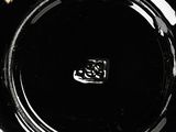 a black plate that has a black design on it