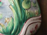 a vase that is sitting on a shelf in a room