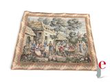 an image of a tapestry with a picture of a village scene on it