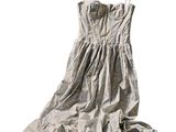 a dress hanging on a hanger on a white background