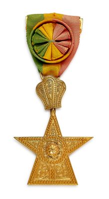 l'image d'une médaille surmontée d'une étoile