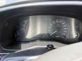 a close up of a dashboard with a speedometer in it