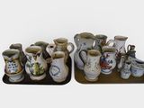 many different types of vases sitting on a tray