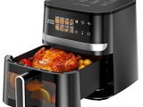 a black air fryer with a turkey inside of it