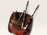 a picture of a pen holder with two pens and a knife