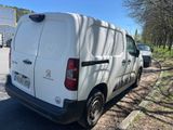 a white van that is parked on the side of the road
