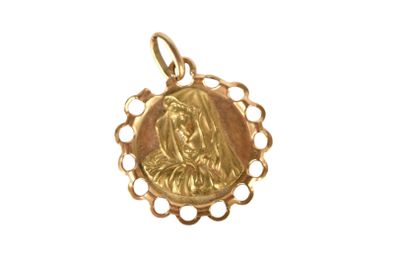 an image of a gold pendant with a virgin on it