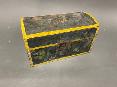 a small wooden box with a yellow handle
