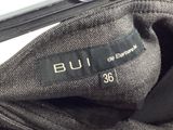 a close up of a suit case with a label on it