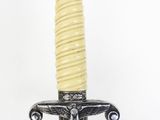 a close up of a sword on a white background