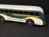 a toy bus that is sitting on a black surface