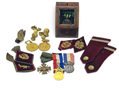 an image of a collection of medals and other items on a white surface