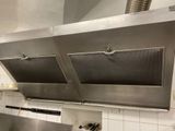 a large stainless steel stove top in a kitchen