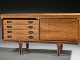 a close up of a wooden cabinet with drawers and drawers