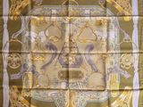 a close up of a square scarf with a design on it
