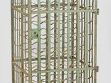 a metal cage with a bunch of bottles inside of it