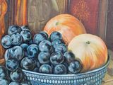 a painting of a bowl of grapes and oranges on a table