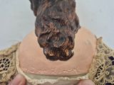 a statue of a dog that is on top of a cake