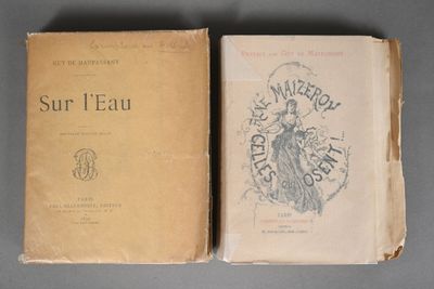 an old book sitting on top of a table next to another book