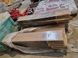several pieces of wood are stacked on top of each other in a pile