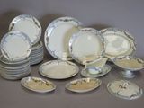 a lot of plates that are sitting on a table
