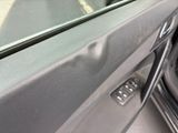 a close up of a car door handle with a key