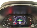 the dashboard of a car with a speedometer and a digital display