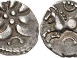 a close up of a coin with a horse on it
