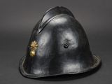 an old helmet with a gold star on the side