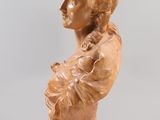 an image of a busturine of a woman with a flower in her hair