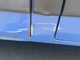a close up of a blue car with orange lights