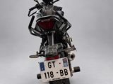 a motorcycle with a license plate on the back of it