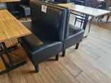 tables and chairs in a restaurant with a price tag on the back