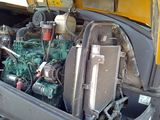 a truck with a large engine in the back of it