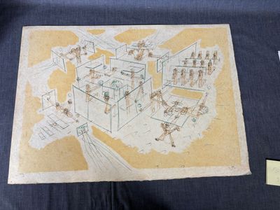 une photo d'un dessin représentant une maison posée sur une table