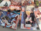 a lot of comic books sitting on a table