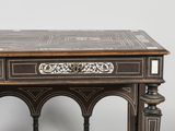 a small table with a drawer on top of it