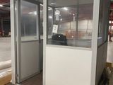 an image of a portable toilet stall in a warehouse