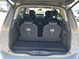 four seats in the back of a car with the doors open