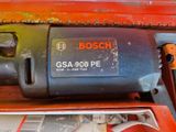 a close up of a small electric drill on a table