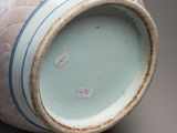 a vase that has a blue and white design on it