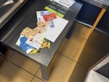 a table that has a laptop on it in a kitchen