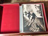 an open box with a picture of a man running down a street